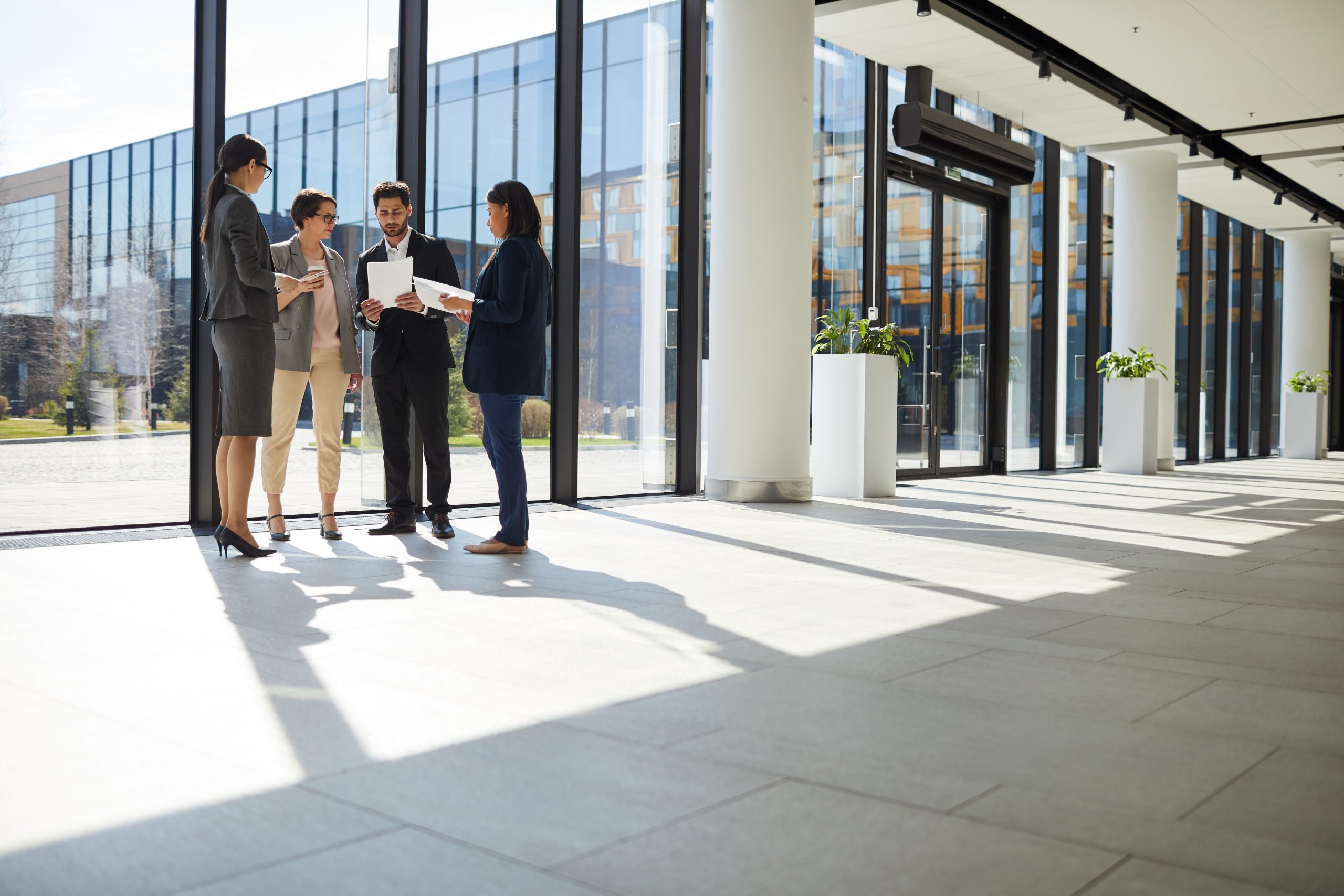 Business people analyzing paper data