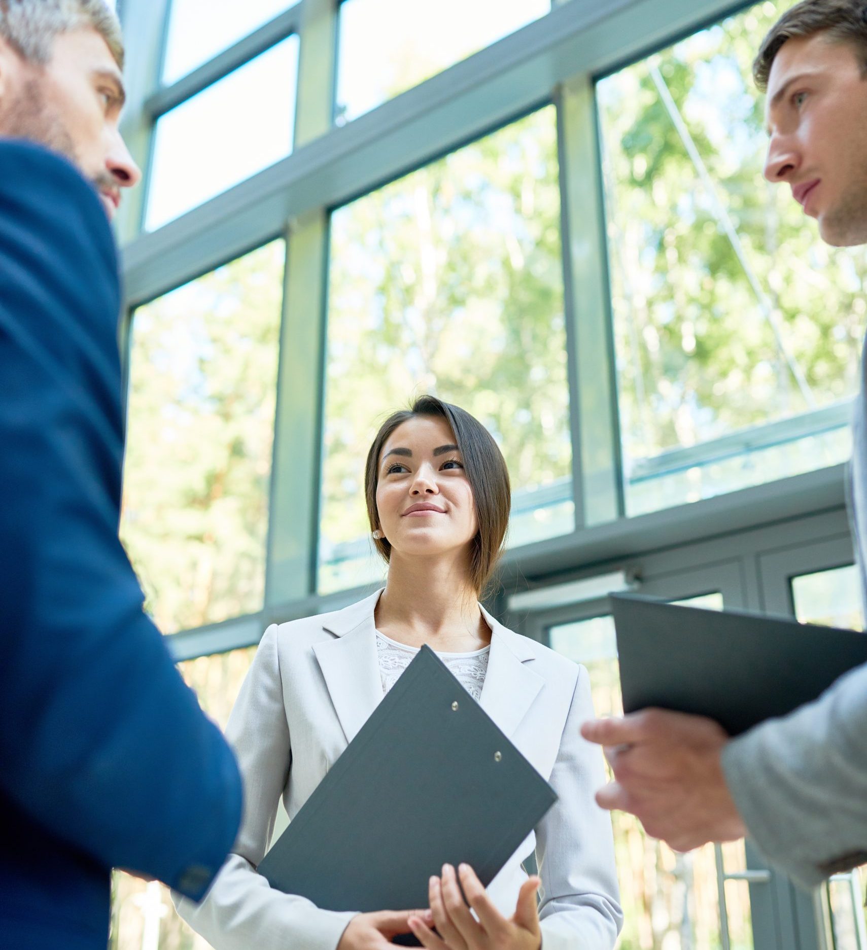 Business People Standing in Hall