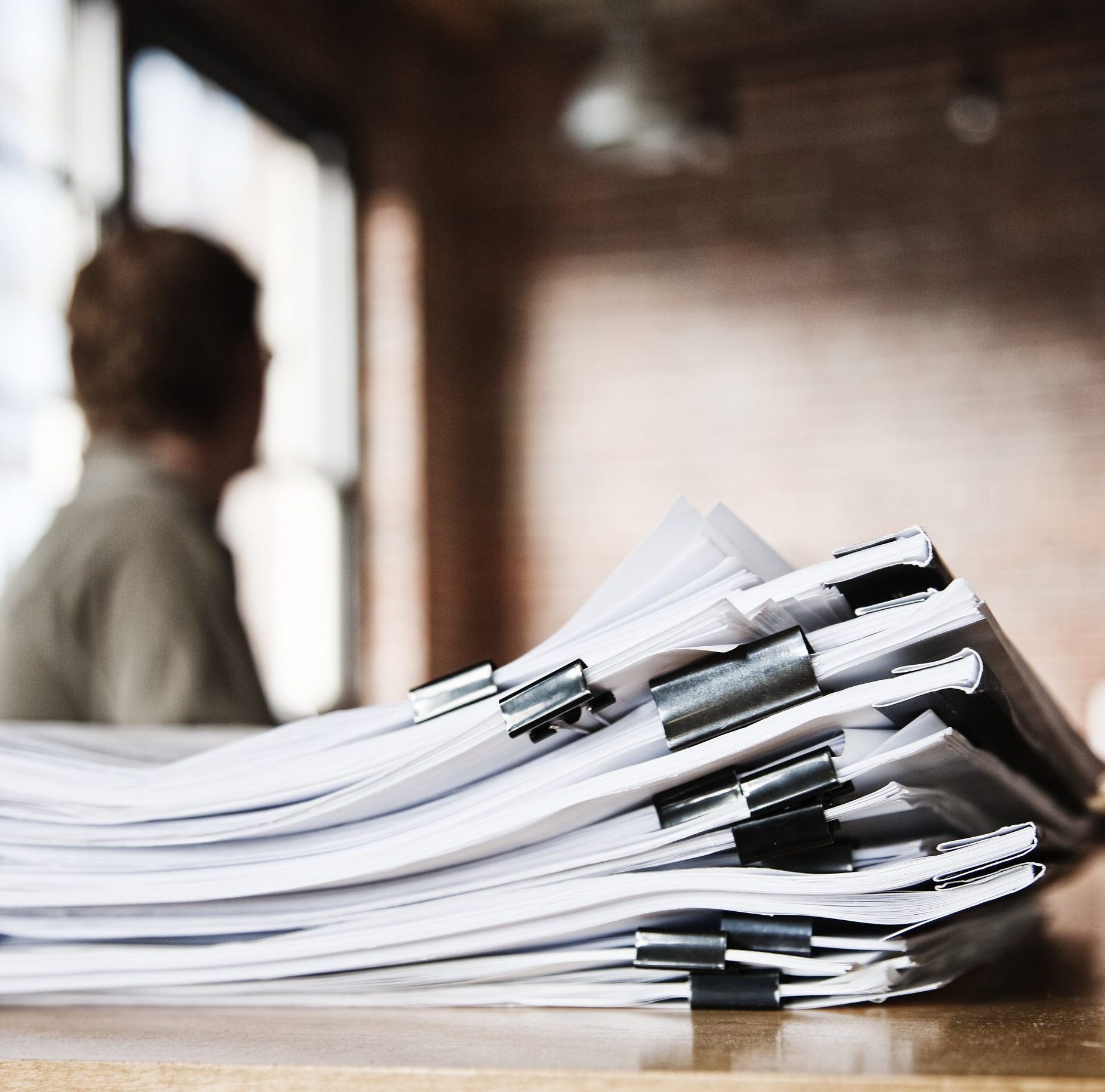Close-up of files and file folders on a desk top in an office.