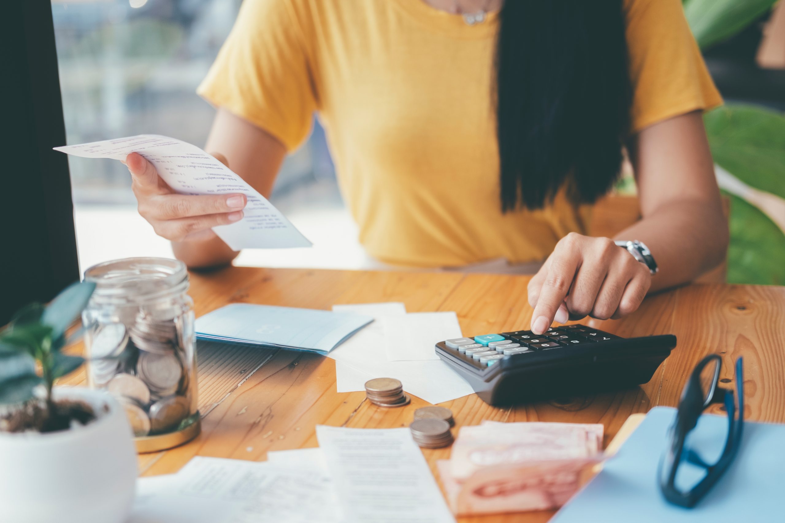 Accountant or banker calculate the cash bill. working out budget