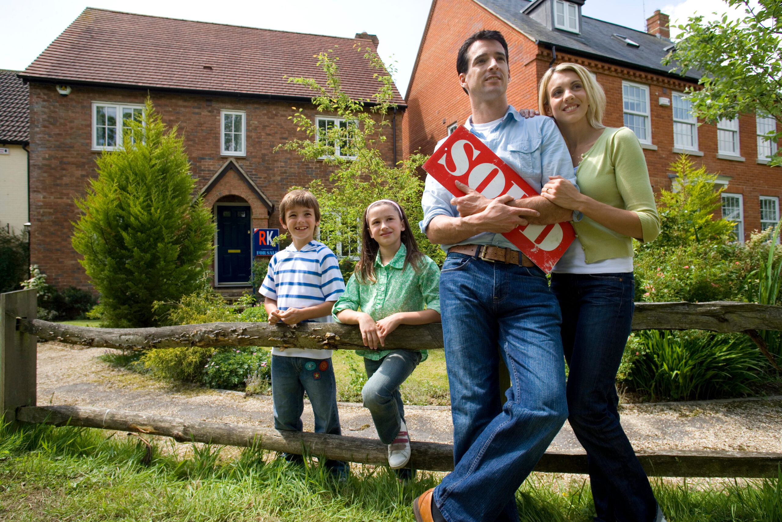 happy-family-celebrating-purchase-of-new-home-2026-03-26-05-09-27-utc What Legal Steps Are Involved in a House Sale